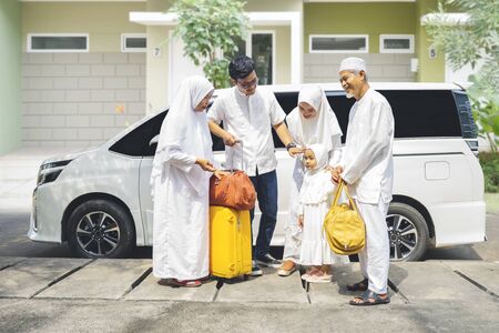 Happy multi-generation muslim family gathering together for Eid Mubarak celebrationの写真素材
