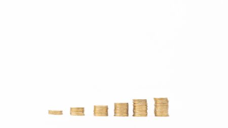 Golden coins stacks symbolizing a chart of growing financial, isolated on white background