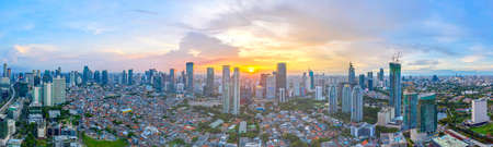 JAKARTA, Indonesia - April 29, 2020: Beautiful aerial Jakarta cityscape at sunset time during...