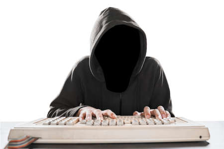 Unknown programmer typing on the computer keyboard at desk, isolated on white backgroundの写真素材