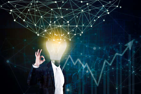 Double exposure of male manager with lightbulb head while showing Ok sign at the camera with network...
