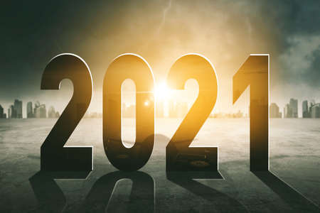 Silhouette of 2021 numbers with modern city background at sunrise timeの写真素材