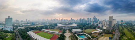 JAKARTA - Indonesia. December 07, 2020: Beautiful panorama aerial photograph of Senayan Stadium with Jakarta cityscape background at morning timeのeditorial素材