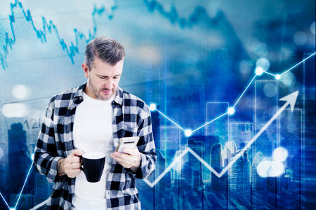 Caucasian man holding a coffee cup and using a mobile phone while standing with upward arrow and...