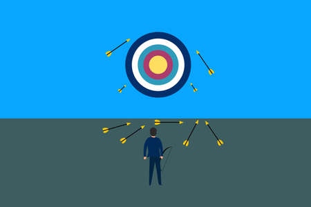 Business fail concept. Businessman failing to hit the target and looking at dartboard