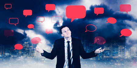 Confused businessman shrugging hands while standing under blank cloud speech with night city...