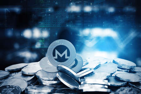 Close up of Monero coin on heap of silver coins with blurred sparkling lights and night city...
