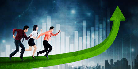 Side view of three business people competing by running above an upward arrow with connection network backgroundの写真素材