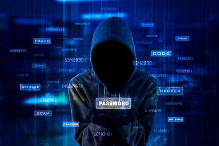 Double exposure of hooded hacker showing password word on hands while standing in the virtual screen backgroundの写真素材