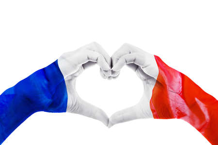 Close up of unknown hands making heart symbol patterned with France flag in the studio. Isolated on white backgroundの写真素材