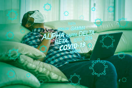 Sick man having difficulty to breath while getting infected covid-19 mutation variant during self isolation at homeの写真素材