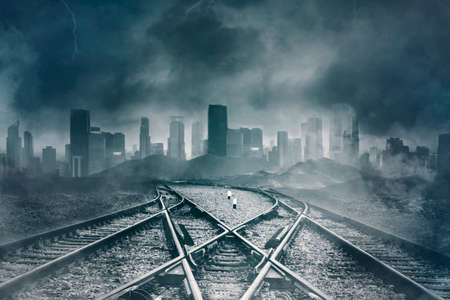 Image of empty railroads with gloomy cityscape background. Concept of Halloween horror