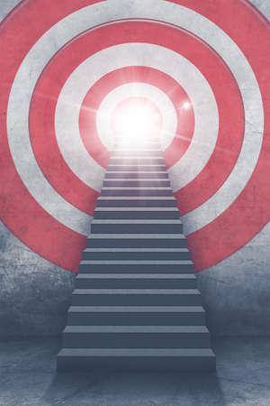 Image of empty stairs toward a red dartboard with shining target backgroundの写真素材