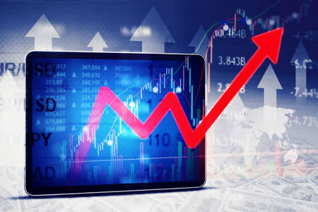 Double exposure of digital tablet screen displaying red upward arrow with currency exchange rate...