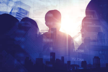 Silhouette of business team meeting in the office with double exposure of exchange currency rate...