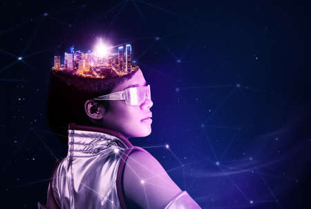 Image of futuristic woman with modern city head standing in the metaverse with virtual screen backgroundの写真素材
