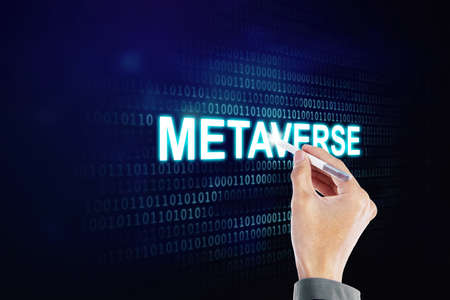Close up of young man hand using a stylus pen to write metaverse word on the virtual screen with code binary backgroundの写真素材