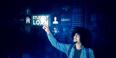 Image of male college student touching student loan text on the virtual screenの写真素材