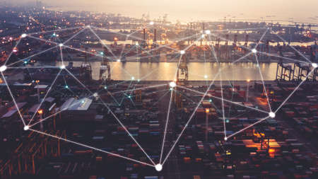 JAKARTA - Indonesia. November 30, 2021: Aerial view of Tanjung Priok industrial port with connection network line at sunrise time in Jakarta, Indonesiaの写真素材