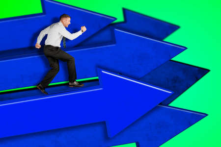 Side view of Caucasian businessman running on the arrow while competing with many arrows in the...