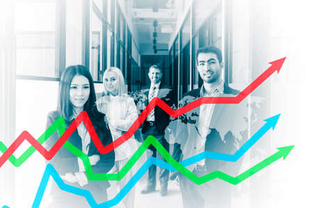 Double exposure of diversity business people smiling at the camera while standing with upward arrow and world map backgroundの写真素材