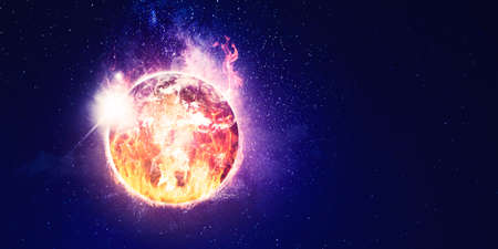 Image of burning globe due to global warming with milky way. Shot at night timeの写真素材
