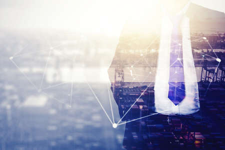 Double exposure of male manager standing with connection network and industrial port background