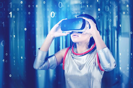 Female robot using VR goggles while standing in the cyberspace with code binary background. Shot in...