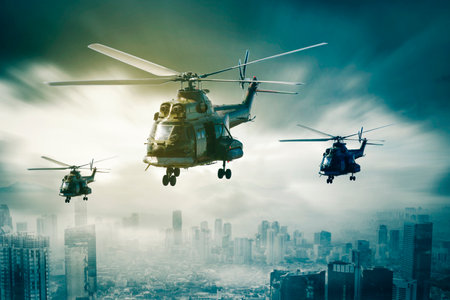 Close up of three military helicopters flying over the misty city at morning timeの写真素材