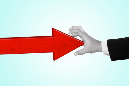 Hand in business suit blocking a 3D arrow moving collage in magazine style. Contemporary art. Modern designの写真素材