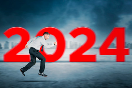 Focus caucasian businessman running toward the future with number 2024 background