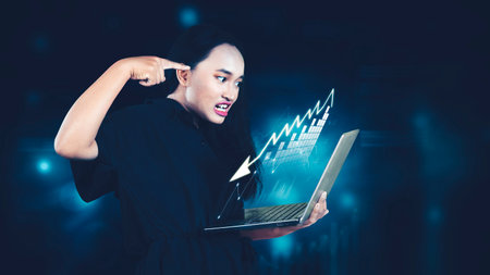 Stock market crash. Depressed female investor looking at market crash on laptop computer.