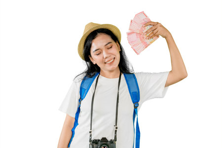 Happy Female Traveler Holding Cash and Smilingの写真素材