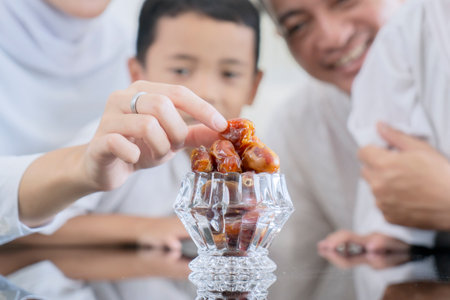 Close-Up of Muslim Family Taking Dates During Ramadan or Eid Celebration