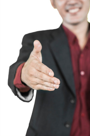 Business Professional Offering Handshake in a Friendly Gestureの写真素材