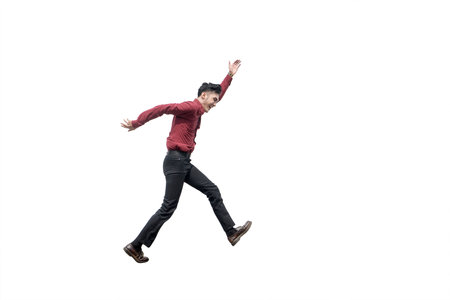 Happy Businessman Jumping with Arms Raised on Isolated White Backgroundの写真素材