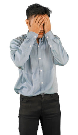 Stressed Man Covering Face in Frustrationの写真素材