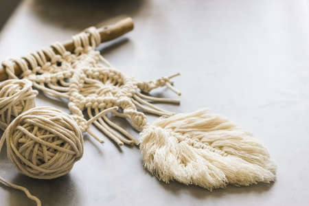 Handmade knitting macrame. Boho lifestyle. Hobby hobby concept. Selective focus. Horizontal frameの写真素材