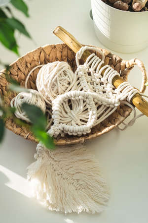 Handmade knitting macrame. Boho lifestyle. Hobby hobby concept. Selective focus vertical frame