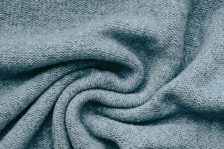 Knitted texture background in trendy gray for wallpapers and backgrounds. Homemade knitting.の写真素材