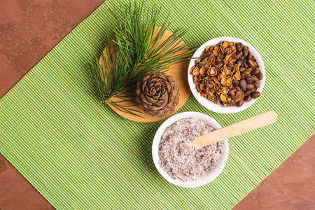 Scrub natural natural organic from pine nuts. Concept for natural cosmetics and body care. Home pharmacy. Top viewの写真素材