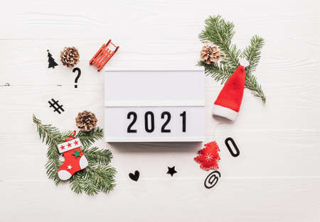 New Year or Christmas layout with numbers 2021. Lightbox with symbols of the year and New Years...
