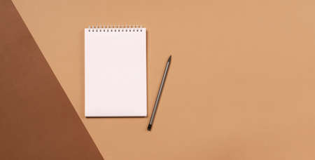 Blank notepad for office or school to write the goals of the task plans. Flat lay top business education concept. Copy spaceの写真素材