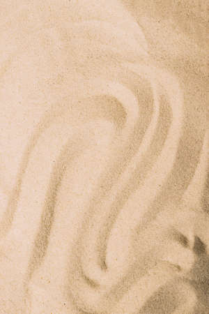 Abstract sand texture. Natural sandy background for product presentation. Top view frameの写真素材