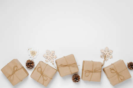 Festive background mockup for Christmas or New Year copy space. Gifts in paper eco-friendly...