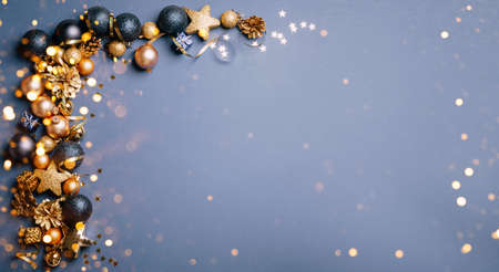 Beautiful gold silver decorations Christmas toys on a dark gray background