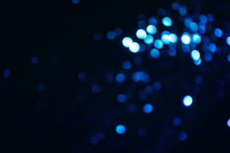 Sparkles multicolored shining on a dark background. Template for creative holiday designの写真素材