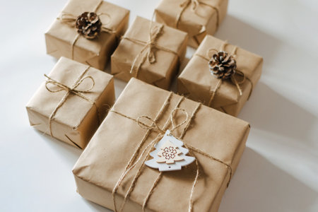 Festive background mockup for Christmas or New Year . Gifts in paper eco-friendly packaging white...