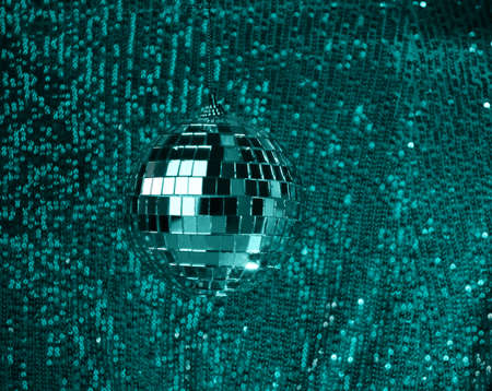 Disco ball luxury green background with sparkles bokeh. Template creative holiday design, new year, christmas, partyの写真素材