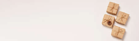 Festive background mockup for Christmas or New Year copy space. Gifts in paper eco-friendly packaging white backgroundの写真素材